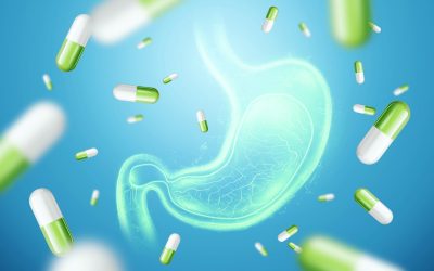 Image of the stomach and pills on a blue background. The concept of diet, intestinal microflora, microorganisms, healthy digestion. 3D render, 3D illustration